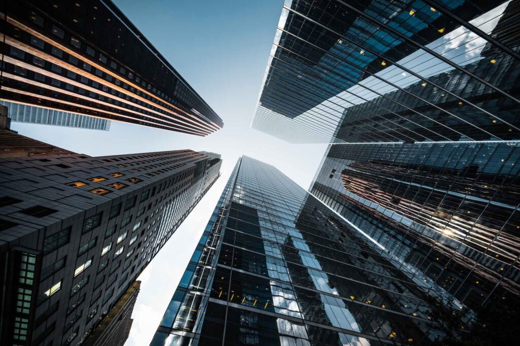 Business and finance concept, looking up at high rise buildings in the financial district of a modern metropolis.